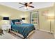 Bright bedroom with a ceiling fan, large window, and a well-lit desk at 76 Bergeson Ct, Fuquay Varina, NC 27526