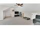 Spacious bonus room featuring a ceiling fan, wall-mounted TV, and a cozy seating area at 76 Bergeson Ct, Fuquay Varina, NC 27526