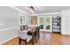 Elegant dining room with hardwood floors, stylish lighting, and access to the backyard at 76 Bergeson Ct, Fuquay Varina, NC 27526
