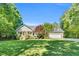 Charming home featuring a manicured lawn and mature trees at 76 Bergeson Ct, Fuquay Varina, NC 27526