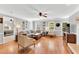 Spacious living room with hardwood floors, neutral decor, and ample natural light at 76 Bergeson Ct, Fuquay Varina, NC 27526