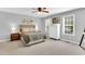 Serene main bedroom with neutral colors, natural light, and plush carpeting at 76 Bergeson Ct, Fuquay Varina, NC 27526