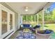 Cozy sunroom with comfortable seating and views of the lush backyard at 76 Bergeson Ct, Fuquay Varina, NC 27526
