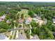Aerial view of homes surrounding the golf course featuring mature trees and well-maintained landscaping at 77 Ruffed Grouse, Chapel Hill, NC 27517
