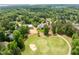Panoramic aerial view of luxury homes surrounding a golf course in a wooded, upscale neighborhood at 77 Ruffed Grouse, Chapel Hill, NC 27517