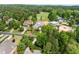 Extensive aerial view of a large property, golf course, and surrounding homes in a beautiful community at 77 Ruffed Grouse, Chapel Hill, NC 27517