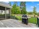 Inviting back porch with a grill, perfect for outdoor cooking and entertaining with a lush lawn at 77 Ruffed Grouse, Chapel Hill, NC 27517