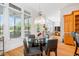 An inviting dining space with a glass table sits adjacent to the kitchen, offering an open view of the property at 77 Ruffed Grouse, Chapel Hill, NC 27517