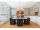 Elegant dining room with chandelier, decorative mirror, and hardwood floors at 77 Ruffed Grouse, Chapel Hill, NC 27517