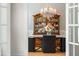Elegant dining room with a chandelier, a wooden china cabinet, and a formal table setting for Gathering meals at 77 Ruffed Grouse, Chapel Hill, NC 27517
