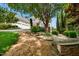 Charming home with a three-car garage, stone accents, and beautiful landscaping creating a welcoming entrance at 77 Ruffed Grouse, Chapel Hill, NC 27517