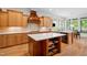 Spacious kitchen featuring wooden cabinets, a center island, and stainless steel appliances for modern cooking at 77 Ruffed Grouse, Chapel Hill, NC 27517