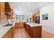 Spacious kitchen features an island, custom cabinetry, and high-end appliances, perfect for cooking at 77 Ruffed Grouse, Chapel Hill, NC 27517
