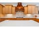 A beautifully designed kitchen with custom cabinetry, modern appliances and quartz countertops at 77 Ruffed Grouse, Chapel Hill, NC 27517