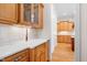 Gourmet kitchen boasts custom cabinetry, quartz countertops, and a seamless transition to adjacent rooms at 77 Ruffed Grouse, Chapel Hill, NC 27517
