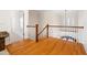 Bright landing featuring hardwood floors and white railing staircase at 77 Ruffed Grouse, Chapel Hill, NC 27517
