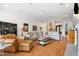Spacious living room with hardwood floors, fireplace, and comfortable seating at 77 Ruffed Grouse, Chapel Hill, NC 27517