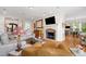 Inviting living room featuring a fireplace, hardwood floors, and comfortable seating at 77 Ruffed Grouse, Chapel Hill, NC 27517