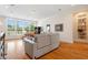 This bright living room offers large windows and hardwood floors, perfect for relaxing or entertaining at 77 Ruffed Grouse, Chapel Hill, NC 27517