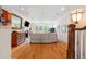 The light filled living room offers large windows, a fireplace, and a view of the landscaped yard at 77 Ruffed Grouse, Chapel Hill, NC 27517