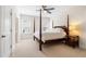 Spacious bedroom with a four-poster bed and neutral carpeting at 77 Ruffed Grouse, Chapel Hill, NC 27517
