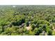 This beautiful property is surrounded by mature trees with a long driveway and neighboring residences at 7901 Farnham Ct, Raleigh, NC 27615