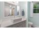 Bright bathroom with updated vanity, sink and fixtures at 7901 Farnham Ct, Raleigh, NC 27615