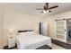 Comfortable bedroom with hardwood floors, neutral walls, and a ceiling fan at 7901 Farnham Ct, Raleigh, NC 27615