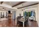 Open-concept dining area features hardwood floors and flows into the bright and airy living room at 7901 Farnham Ct, Raleigh, NC 27615