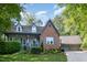 Charming brick home featuring a well-manicured lawn and a detached two-car garage at 7901 Farnham Ct, Raleigh, NC 27615