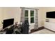 Cozy home office with large window, modern curtains, and streamlined decor at 7901 Farnham Ct, Raleigh, NC 27615