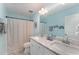 Bathroom with double sink vanity, granite countertop, and modern fixtures at 808 Buckner Ct, Fuquay Varina, NC 27526