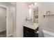 Bright bathroom with a single sink vanity and a walk-in shower at 808 Buckner Ct, Fuquay Varina, NC 27526