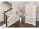 Elegant home foyer featuring hardwood floors, staircase, and crown molding, providing a welcoming entrance at 808 Buckner Ct, Fuquay Varina, NC 27526