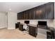 Functional home office with wall-to-wall cabinets, integrated desks, and plenty of workspace for multiple users at 808 Buckner Ct, Fuquay Varina, NC 27526