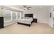 A view of the main bedroom with a ceiling fan, window and a large bed at 808 Buckner Ct, Fuquay Varina, NC 27526