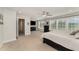 A bright main bedroom featuring a ceiling fan and view of the yard at 808 Buckner Ct, Fuquay Varina, NC 27526