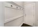 A clean mud room boasts beadboard paneling with hooks, providing a functional entry space at 808 Buckner Ct, Fuquay Varina, NC 27526