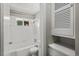 Bathroom features bathtub shower combo and a window at 809 Leon St, Durham, NC 27704