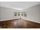 Bright bedroom featuring hardwood floors, with multiple windows to let in the natural light at 809 Leon St, Durham, NC 27704