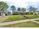 Charming brick home with manicured lawn and landscaped yard at 809 Leon St, Durham, NC 27704