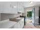 Kitchen with stainless steel appliances. Includes outside access to deck at 809 Leon St, Durham, NC 27704