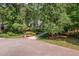 Aerial shot of a home nestled among lush trees, showcasing its private and serene setting at 8304 Epping Forest Way, Wake Forest, NC 27587