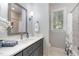 Charming bathroom with modern vanity, marble countertops, and ample natural light at 8304 Epping Forest Way, Wake Forest, NC 27587