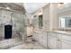 Elegant bathroom with glass shower, double vanities, and a neutral color scheme at 8304 Epping Forest Way, Wake Forest, NC 27587