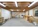 Versatile shed interior with ample space, wood beams, and staircase leading to upper storage at 8304 Epping Forest Way, Wake Forest, NC 27587
