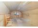 Upper level of the shed featuring wood interior, storage shelves and natural light from window at 8304 Epping Forest Way, Wake Forest, NC 27587