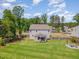 Aerial view of home's backyard, showcasing the patio and fire pit at 8616 Deep Elm Dr, Wake Forest, NC 27587