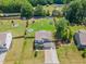 Aerial view of home highlighting its large backyard, landscaping, and neighborhood at 8616 Deep Elm Dr, Wake Forest, NC 27587