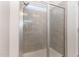 Modern tiled shower enclosure featuring frameless glass and shower head at 8616 Deep Elm Dr, Wake Forest, NC 27587